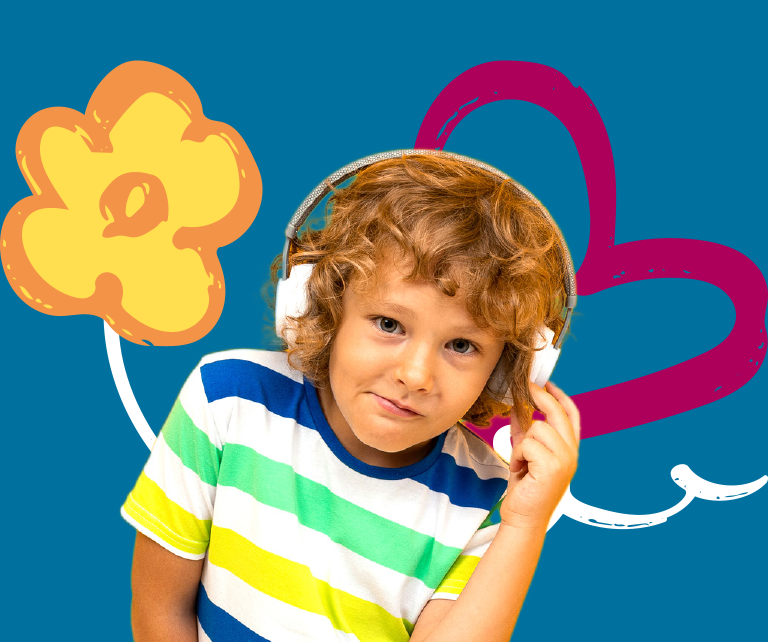 Young boy smiling listening to music on a pair of wireless headphones. 