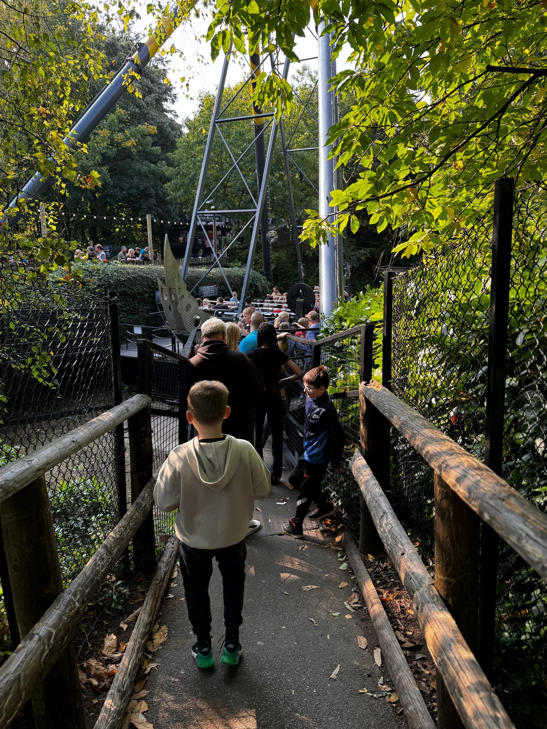 People waiting in a que to get on a pirate ship ride